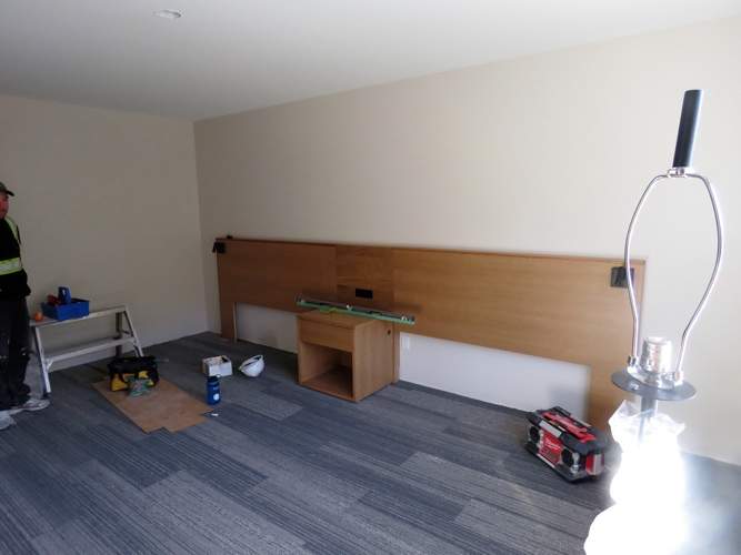Carpet is installed and furniture is moved into the rooms on the 3rd floor of Kwa’lilas Hotel.