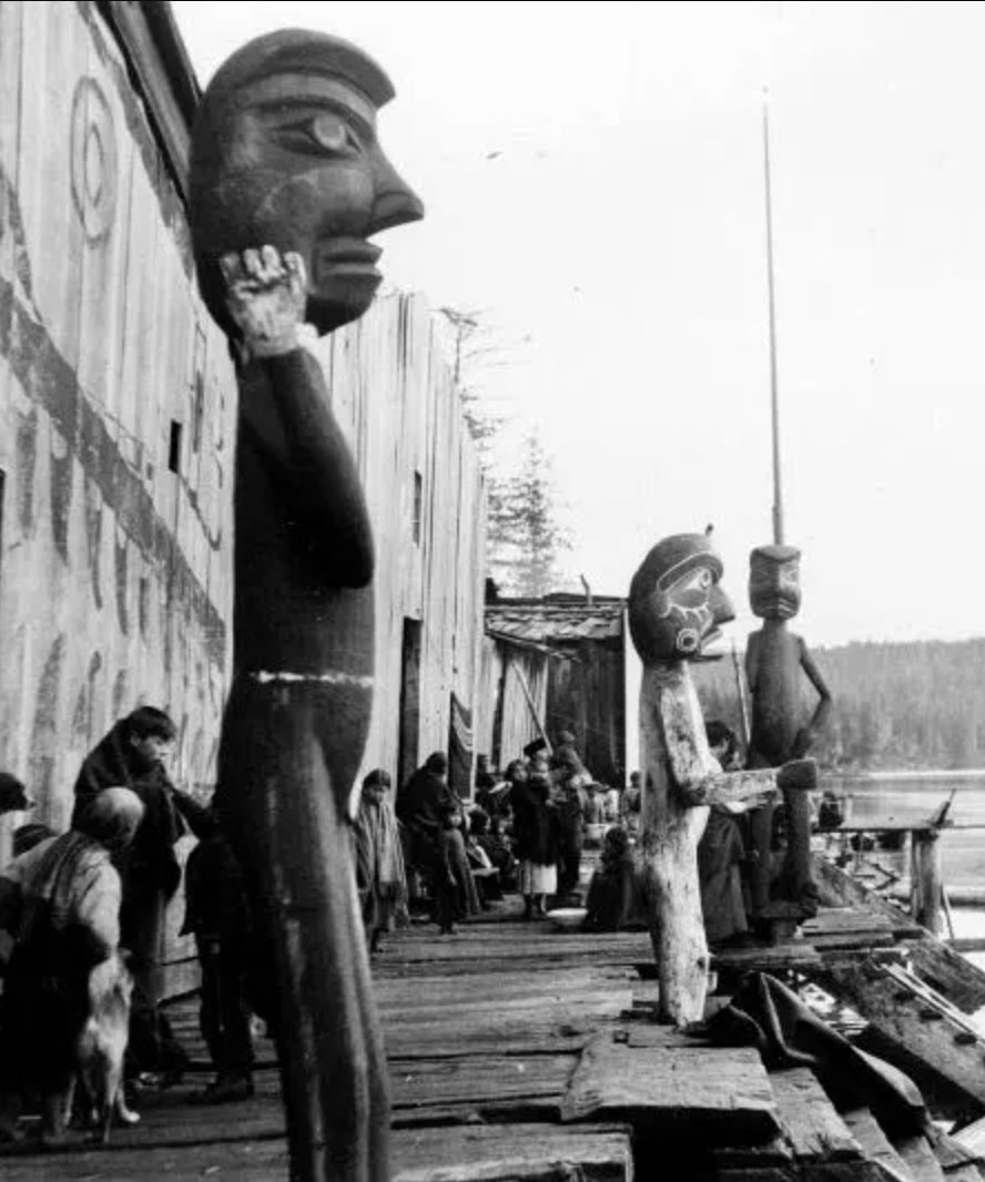 Black and white photograph of Ba'as Village at Blunden Harbour in 1901.